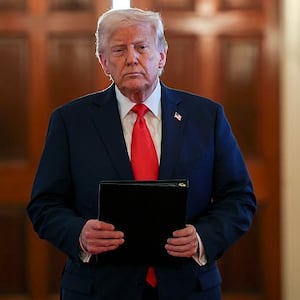 U.S. President Donald Trump arrives for a presentation ceremony for the Commander-in-Chief Trophy to the U.S. Naval Academy in the East Room of the White House on April 15, 2025 in Washington, DC.