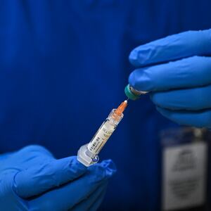 A health worker prepares a dose of the measles vaccine at a health center in Lubbock, Texas, on February 27, 2025. Dozens of children are being rushed to a health center in the US state of Texas to get the measles vaccine, after the recent death in the area of a child who was not immunized against the highly contagious virus. The death came as immunization rates have declined nationwide, with the latest cases in the west Texas town of Lubbock concentrated in a Mennonite religious community that has historically shown vaccine hesitancy. (Photo by RONALDO SCHEMIDT / AFP) (Photo by RONALDO SCHEMIDT/AFP via Getty Images)