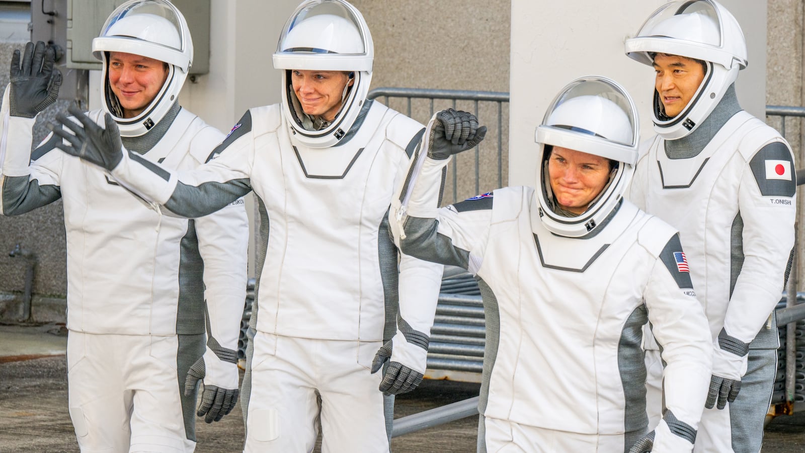 NASA astronauts commander Anne McClain and pilot Nichole Ayers, alongside mission specialists, JAXA (Japan Aerospace Exploration Agency) astronaut Takuya Onishi and Roscosmos cosmonaut Kirill Peskov exit the Neil A. Armstrong Operations and Checkout building at NASA Kennedy ahead of launch on March 14, 2025 in Cape Canaveral, Florida.