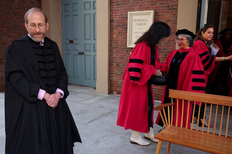 Interim president Alan Garber waits for the the honorary degree recipients to assemble for a group photograph before the 373rd Commencement Exercises at Harvard University in Cambridge, Massachusetts, U.S., May 23, 2024. REUTERS/Brian Snyder