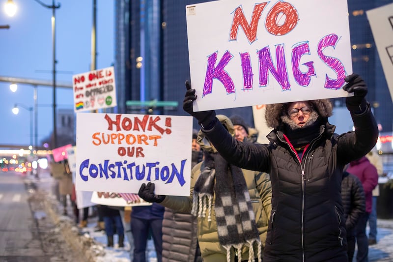 People protest on President's Day in Detroit, Michigan, in response to what they say are President Trump's and Elon Musk's undemocratic actions.