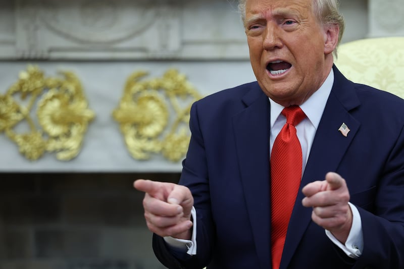 President Donald Trump answers questions as he meets with El Salvador's President Nayib Bukele in the White House April 14, 2025 in Washington, D.C.