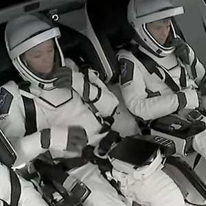 Crew-10 wait to be escorted out of the rocket following the mission’s stand down.