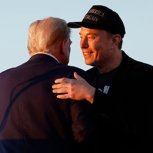Elon Musk embraces Donald Trump during a campaign rally on October 05, 2024 in Butler, Pennsylvania.