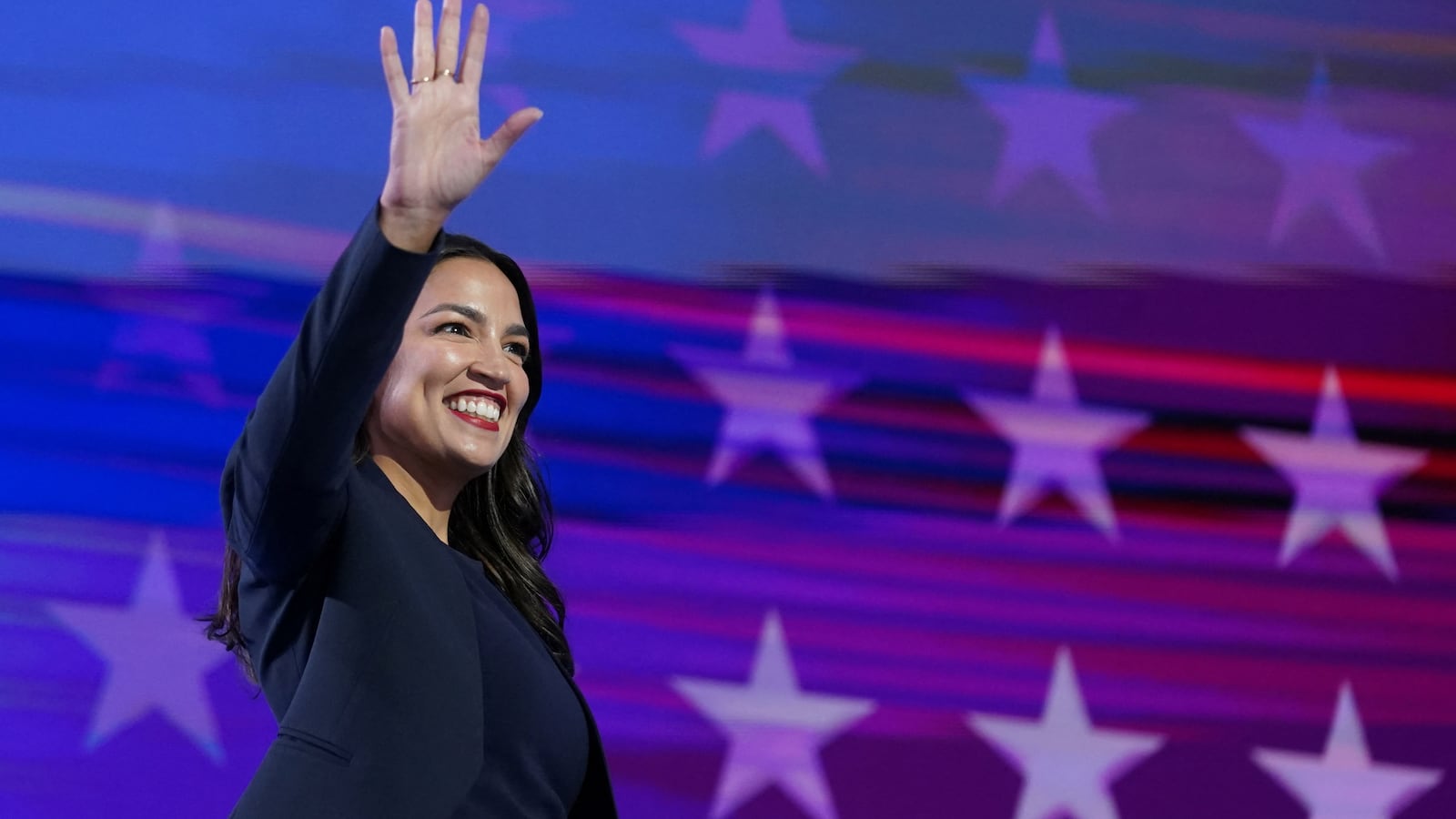 U.S. Representative Alexandria Ocasio-Cortez takes to the stage at the Democratic National Convention in Chicago, Illinois on August 19, 2024.