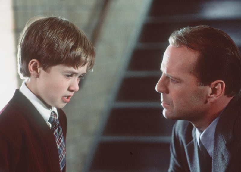 Bruce Willis Stars As Child Psychologist Dr. Malcolm Crowe And Haley Joel Osment (L) Stars As Cole Sear Who Has A Dark Secret In "The Sixth Sense."