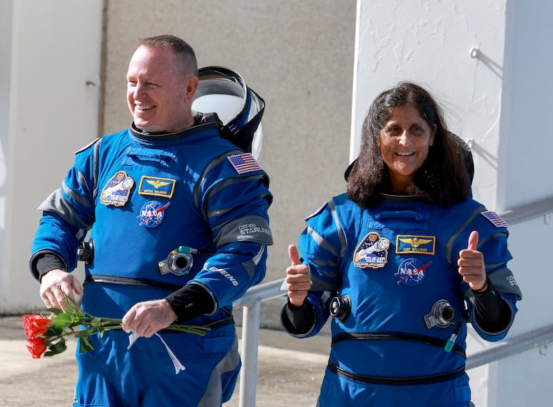 NASA’s Boeing Crew Flight Test Commander Butch Wilmore (L) and Pilot Suni Williams walk out of the Operations and Checkout Building on June 01, 2024 in Cape Canaveral, Florida.